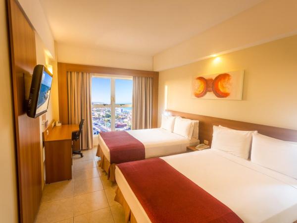 Praiamar Express Hotel : photo 1 de la chambre chambre standard avec 2 lits doubles