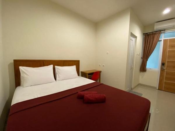 The Home Srengseng : photo 2 de la chambre chambre standard lit queen-size