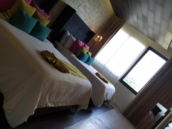 Hotel Beló Isla Mujeres - All Inclusive : photo 3 de la chambre suite junior de luxe avec 2 lits doubles