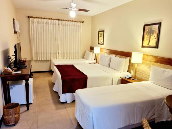 Pousada Corsario Buzios : photo 3 de la chambre chambre quadruple - vue sur jardin