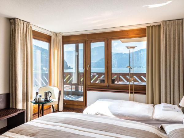 Seehotel Sternen : photo 2 de la chambre chambre double avec lit d'appoint et vue sur le lac