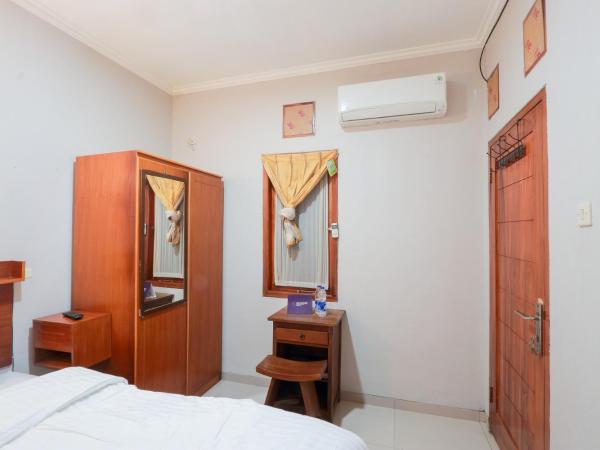 Singgahsini Griya Raflesia Kebayoran Lama : photo 8 de la chambre chambre double standard