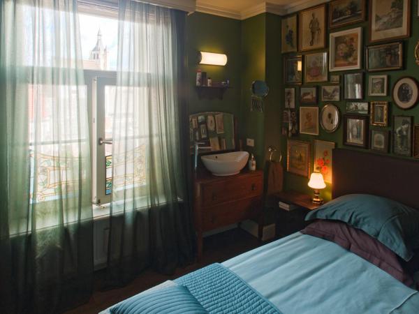 B&B De Lachende Engel : photo 1 de la chambre chambre double avec coin salon