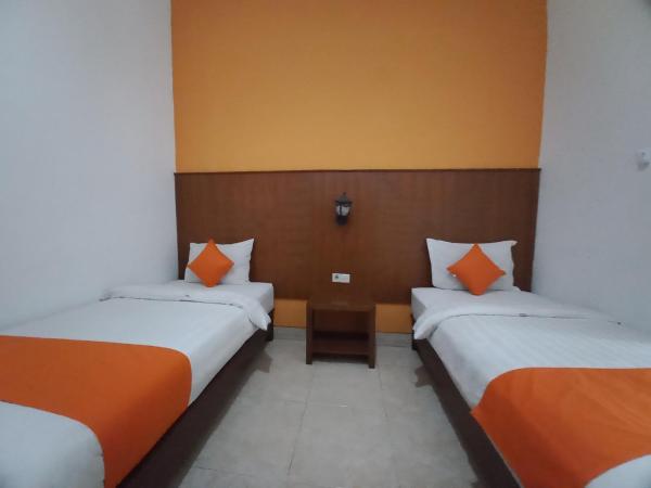 Hotel Poncowinatan - Tugu : photo 3 de la chambre chambre lits jumeaux Économique