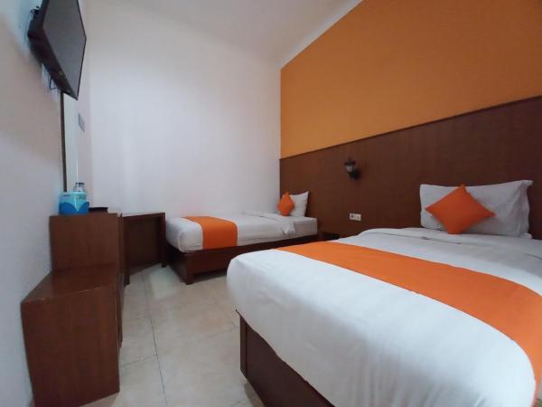 Hotel Poncowinatan - Tugu : photo 4 de la chambre chambre lits jumeaux Économique