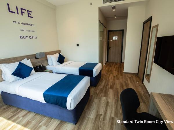 Grand Kingsgate Jaddaf Waterfront Hotel by Millennium : photo 2 de la chambre chambre lits jumeaux standard