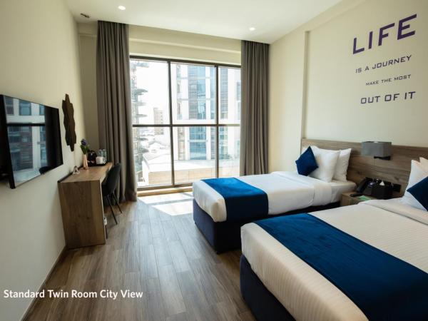 Grand Kingsgate Jaddaf Waterfront Hotel by Millennium : photo 1 de la chambre chambre lits jumeaux standard