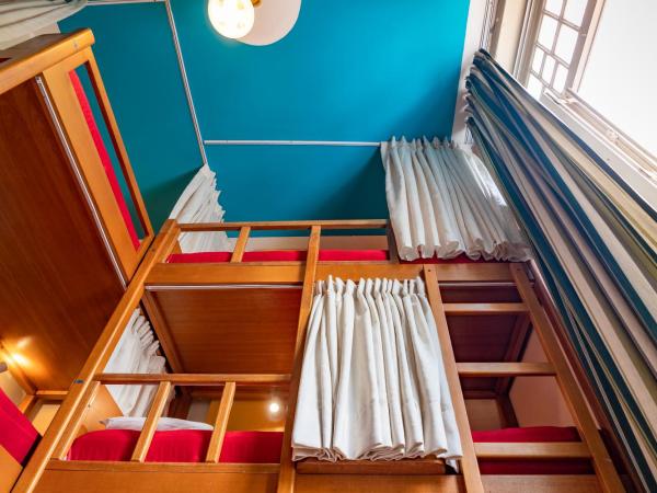 Discovery Hostel : photo 2 de la chambre lit simple dans un dortoir mixte de 9 lits