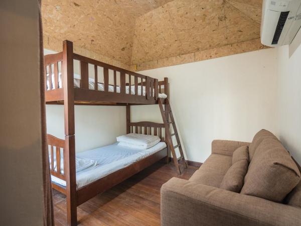 Yi's Garden Villa : photo 2 de la chambre suite familiale avec balcon