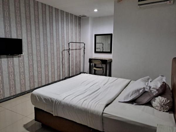 UNIK Guest House Syariah : photo 2 de la chambre chambre double standard