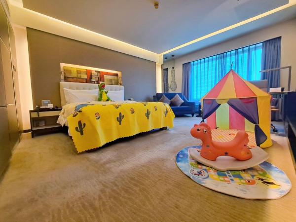 Furama Hotel Dalian : photo 1 de la chambre chambre deluxe double ou lits jumeaux