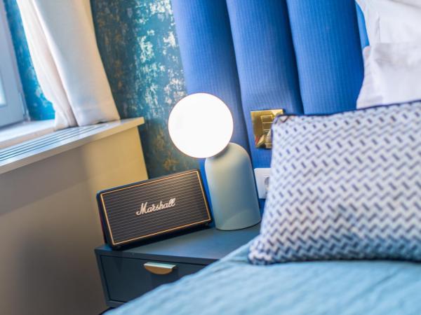 The Melegran : photo 2 de la chambre chambre double deluxe (2 adultes + 1 enfant) (bâtiment annexe)