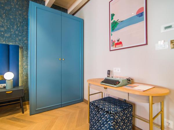 The Melegran : photo 1 de la chambre chambre double deluxe (2 adultes + 1 enfant) (bâtiment annexe)