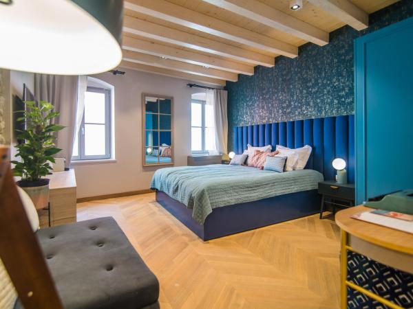 The Melegran : photo 3 de la chambre chambre double deluxe (2 adultes + 1 enfant) (bâtiment annexe)