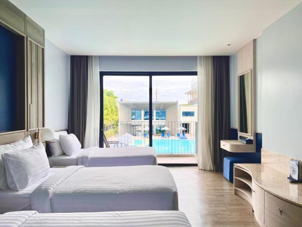 Seabed Grand Hotel Phuket - SHA Extra Plus : photo 1 de la chambre chambre triple - vue sur la piscine