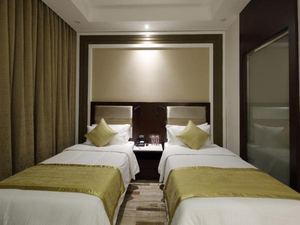 Regenta Inn Ranip Ahmedabad : photo 4 de la chambre chambre double ou lits jumeaux deluxe 