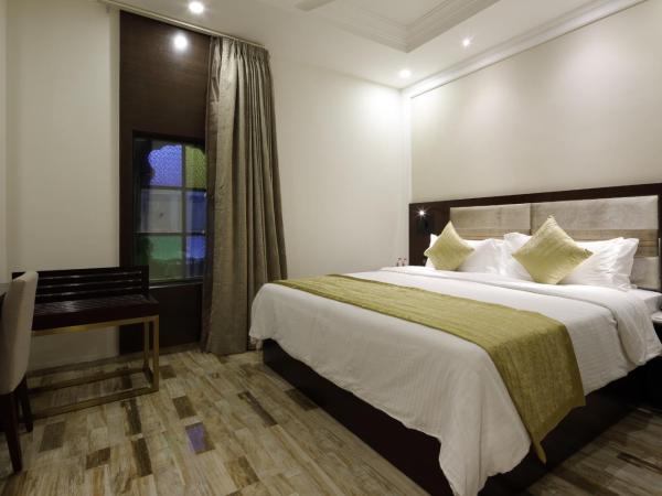 Regenta Inn Ranip Ahmedabad : photo 3 de la chambre chambre double ou lits jumeaux deluxe 
