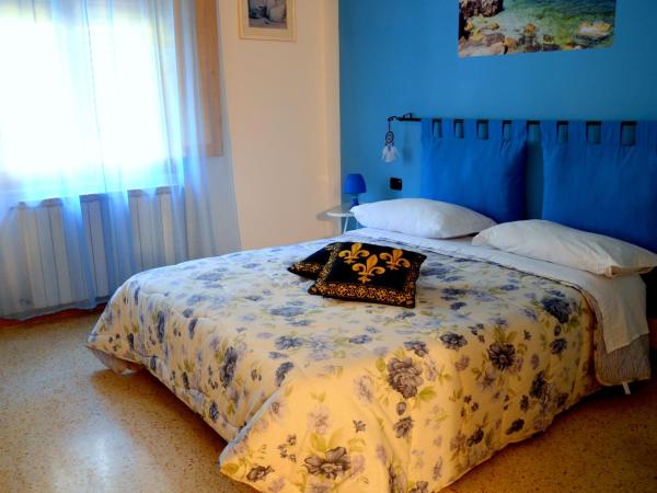 L'Acchiappasogni : photo 1 de la chambre chambre double ou lits jumeaux deluxe – vue sur jardin