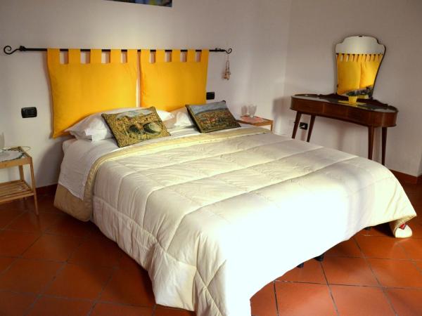 L'Acchiappasogni : photo 1 de la chambre chambre double ou lits jumeaux supérieure - vue sur jardin