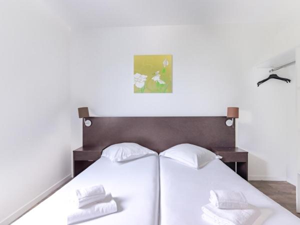 All Suites Bordeaux Lac - Parc des Expositions : photo 3 de la chambre appartement (1 canapé-lit et 2 lits simples)