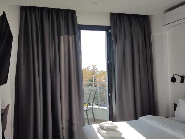 White Trilogy : photo 4 de la chambre chambre double ou lits jumeaux deluxe avec balcon