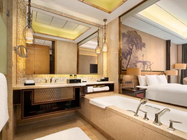 Wanda Vista Dongguan - Free Canton Fair shuttle bus to Canton Fair exhibition center during Canton Fair period : photo 1 de la chambre grande chambre lit king-size