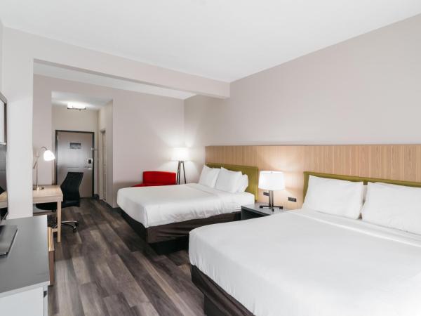 Country Inn & Suites by Radisson, Wolfchase-Memphis, TN : photo 2 de la chambre chambre avec 2 grands lits queen-size 