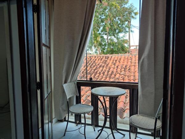 Pousada L'étage : photo 1 de la chambre chambre double avec patio