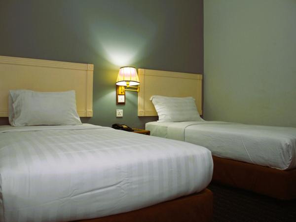 Sandakan Inn : photo 4 de la chambre chambre lits jumeaux deluxe