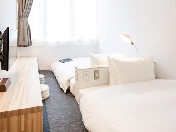 Hotel Potmum Sapporo : photo 1 de la chambre chambre lits jumeaux avec salle de bains privative