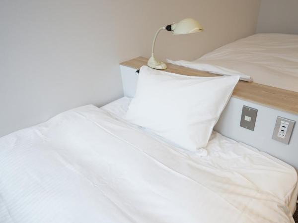 Hotel Potmum Sapporo : photo 2 de la chambre chambre lits jumeaux avec salle de bains privative