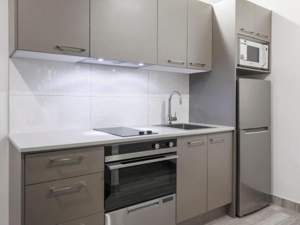 CityLife Wellington : photo 4 de la chambre suite 2 chambres excécutive avec 1 lit queen-size et 2 lits simples