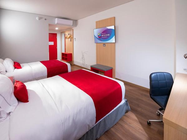 Ramada Encore by Wyndham Guadalajara Aeropuerto : photo 4 de la chambre chambre double avec 2 lits doubles - non-fumeurs