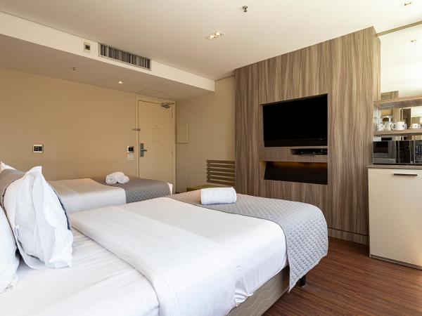 You Stay at Vila Olimpia - ITC : photo 6 de la chambre chambre lit king-size deluxe