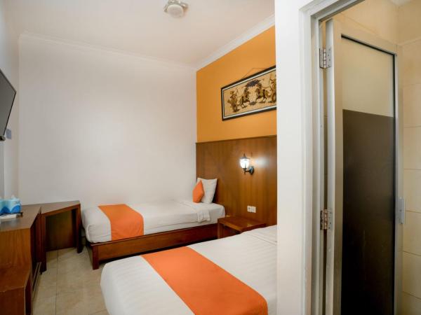 Hotel Poncowinatan - Tugu : photo 2 de la chambre chambre lits jumeaux Économique