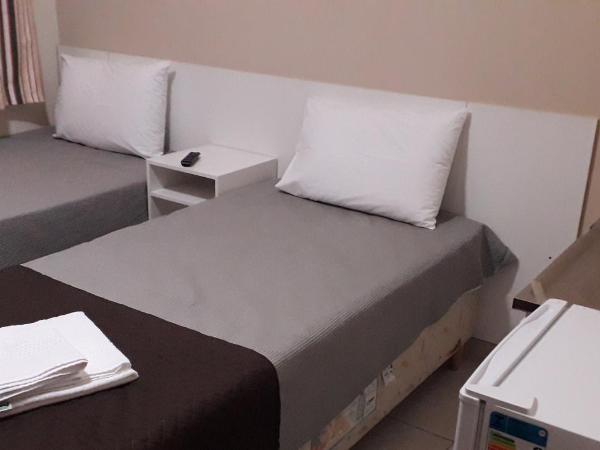 BH EXPO SUITES & KITNETES : photo 1 de la chambre chambre lits jumeaux avec salle de bains privative