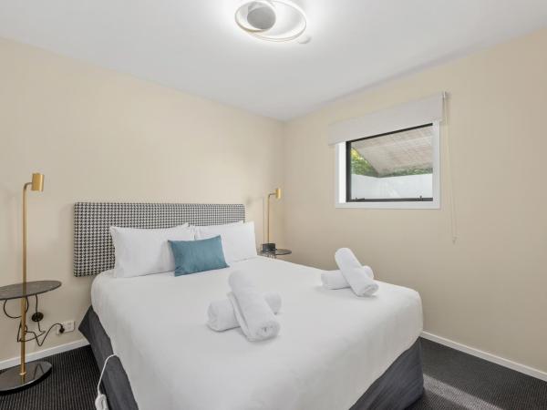 ASURE Rotorua International Motor Inn : photo 1 de la chambre hébergement 1 chambre deluxe avec baignoire spa