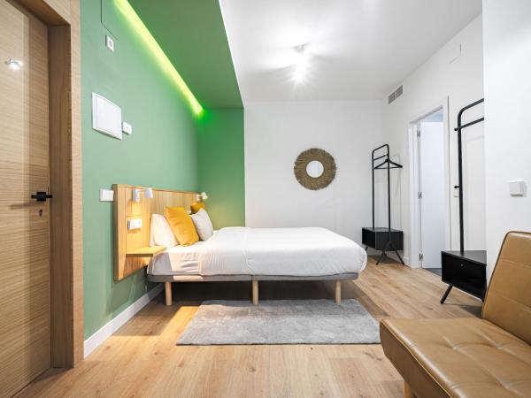 Vallecas Suites by Olala Homes : photo 7 de la chambre chambre triple