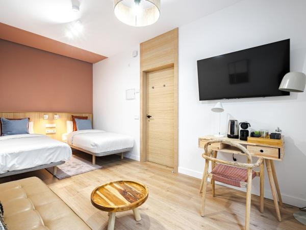 Vallecas Suites by Olala Homes : photo 8 de la chambre chambre quadruple