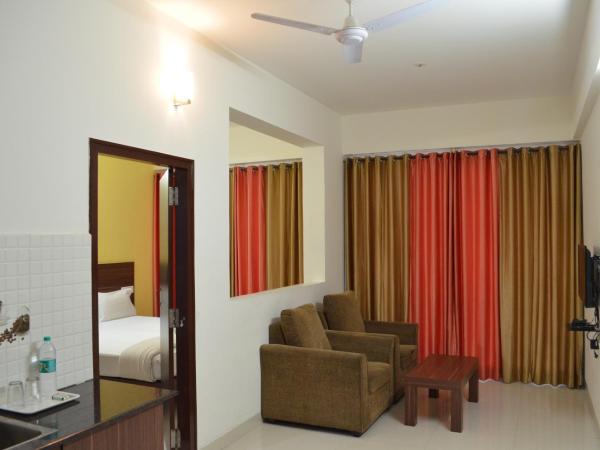 Grand Suites Yelahanka : photo 2 de la chambre chambre double deluxe avec balcon