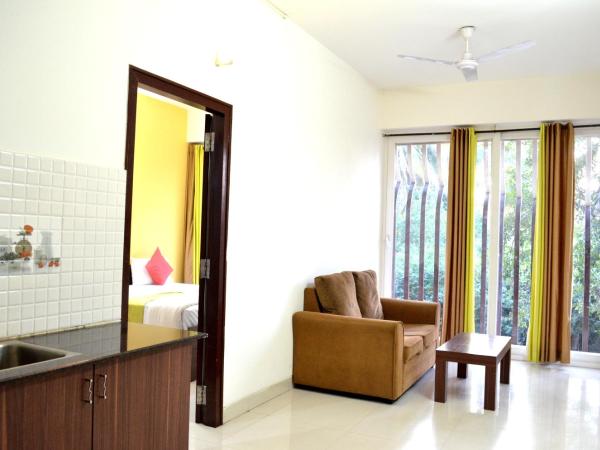 Grand Suites Yelahanka : photo 7 de la chambre chambre double deluxe avec balcon