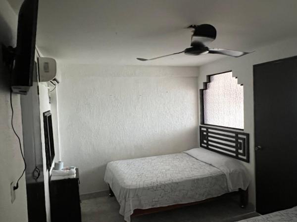 Hotel magallanes con cocineta 100 Metros de playa : photo 3 de la chambre chambre lits jumeaux avec salle de bains privative