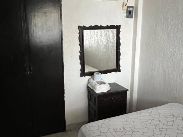 Hotel magallanes con cocineta 100 Metros de playa : photo 4 de la chambre chambre lits jumeaux avec salle de bains privative