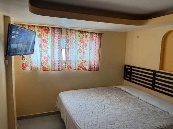 Hotel magallanes con cocineta 100 Metros de playa : photo 6 de la chambre chambre lits jumeaux avec salle de bains privative