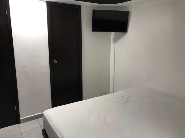 Hotel magallanes con cocineta 100 Metros de playa : photo 3 de la chambre chambre lits jumeaux avec salle de bains privative