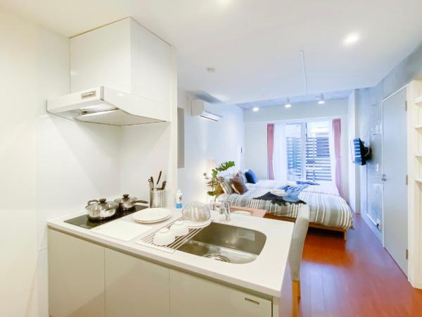 japan house nishishinjuku : photo 1 de la chambre chambre lits jumeaux - vue sur jardin