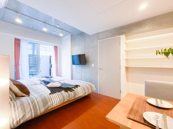 japan house nishishinjuku : photo 8 de la chambre chambre lits jumeaux - vue sur jardin