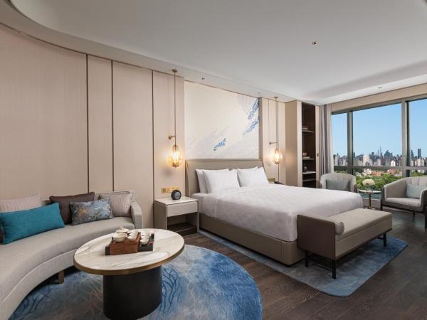 HUALUXE Shanghai Changfeng Park, an IHG Hotel : photo 1 de la chambre suite lit king-size 1 chambre avec cuisine