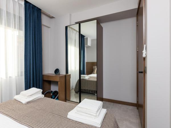 BİSUİTES : photo 6 de la chambre chambre double ou lits jumeaux avec terrasse