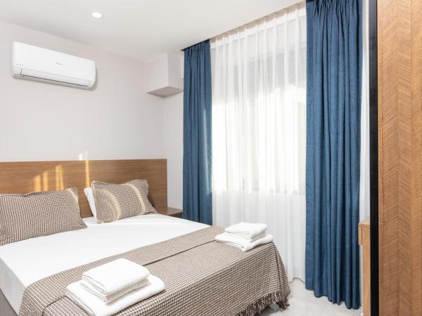 BİSUİTES : photo 7 de la chambre chambre double ou lits jumeaux avec terrasse